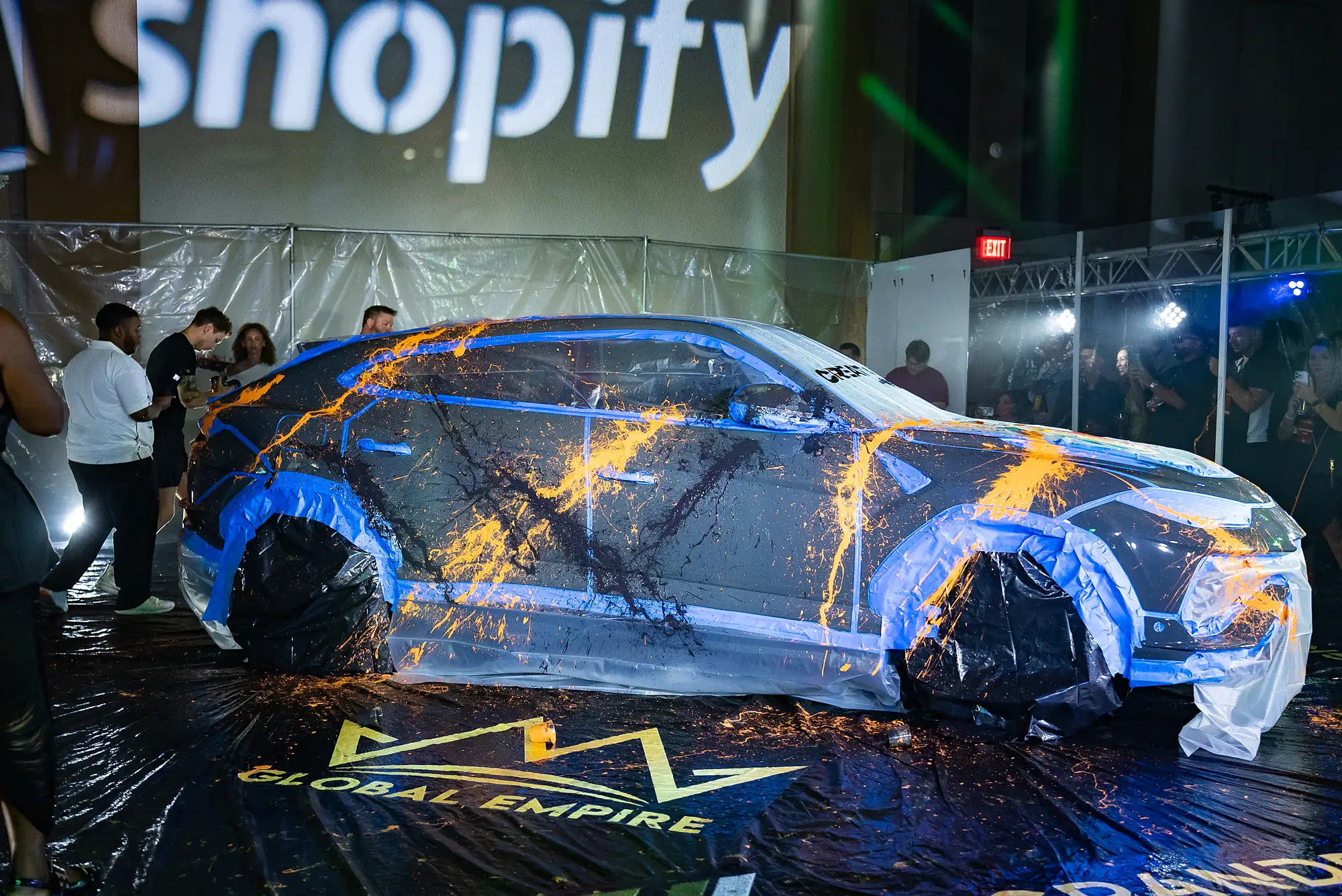 A paint-splashed art car on the CreatorHub expo floor
